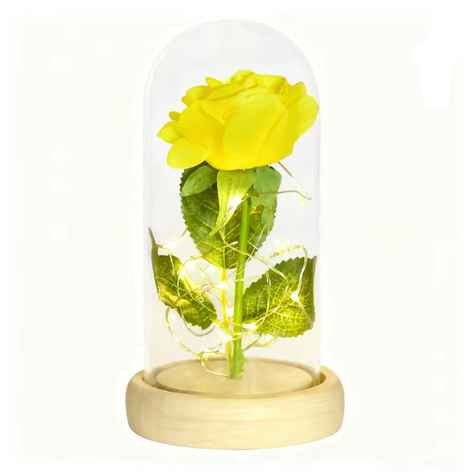Yellow rose in a glass dome with wooden base on a white background
